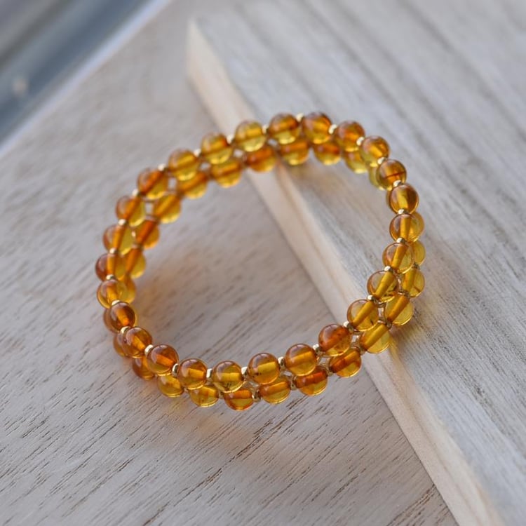 Pozlátený náramok s koňakovými jantármi 52313