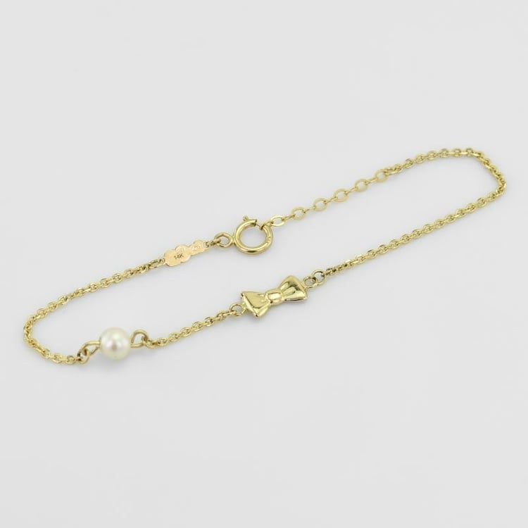 Zlatý detský náramok s mašličkou a perlou 51521