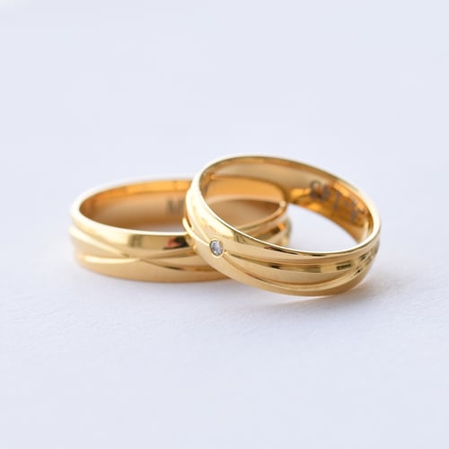 Elegantné zlaté svadobné prstene s diamantom Weber