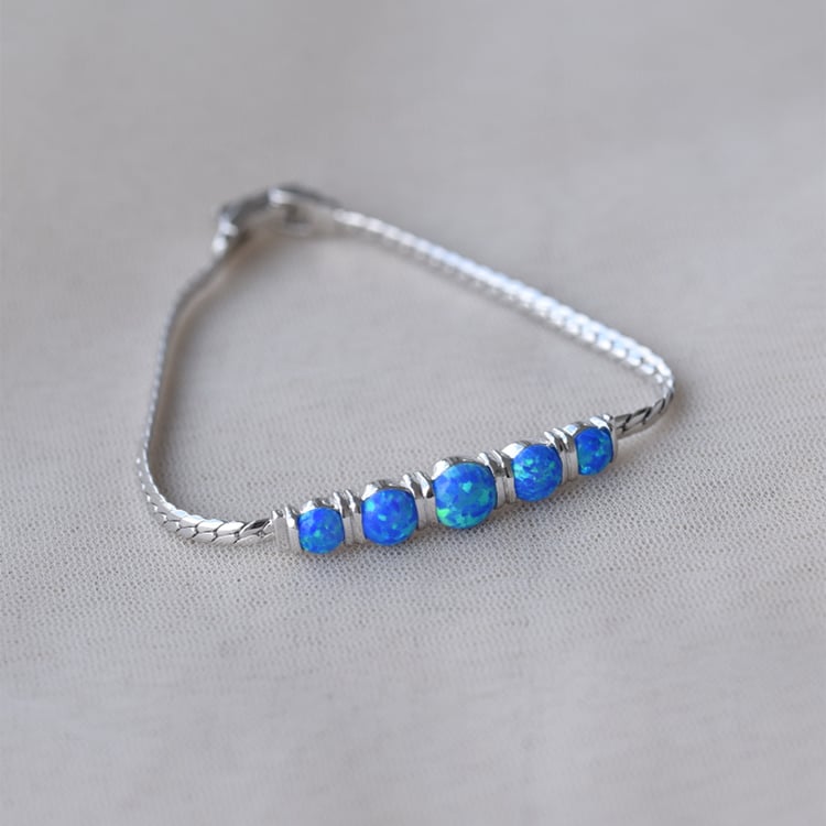 Náramok zdobený modrými opály 65294