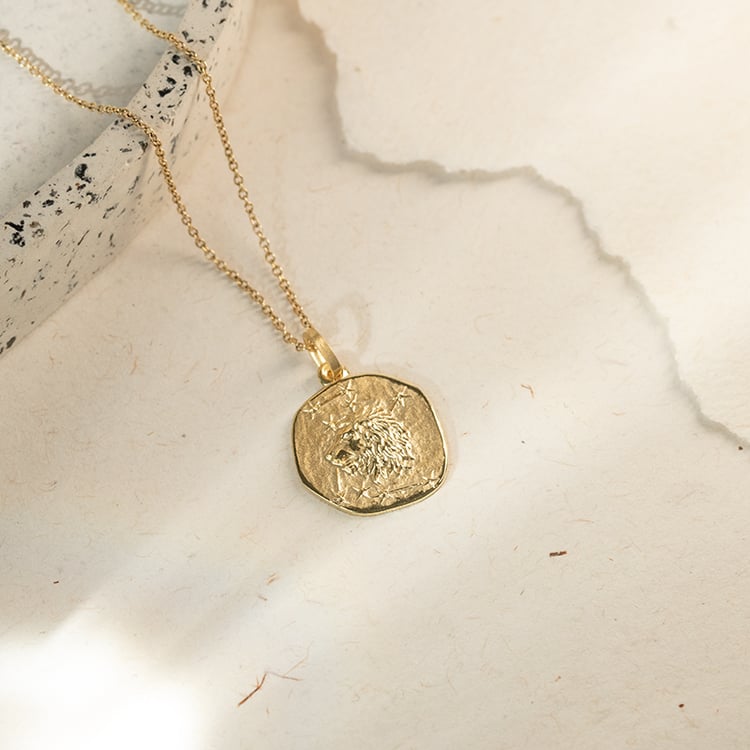 Zlatý prívesok so symbolmi znamenia zverokruhu 143643