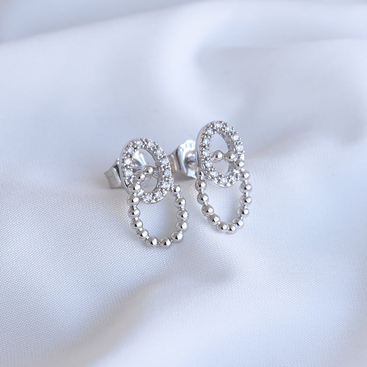 Preplétané náušnice s diamantmi z bieleho zlata 85038