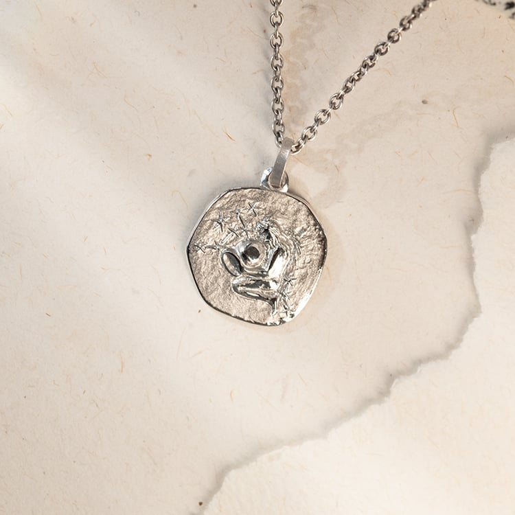 Zlatý prívesok so symbolmi znamenia zverokruhu 143679