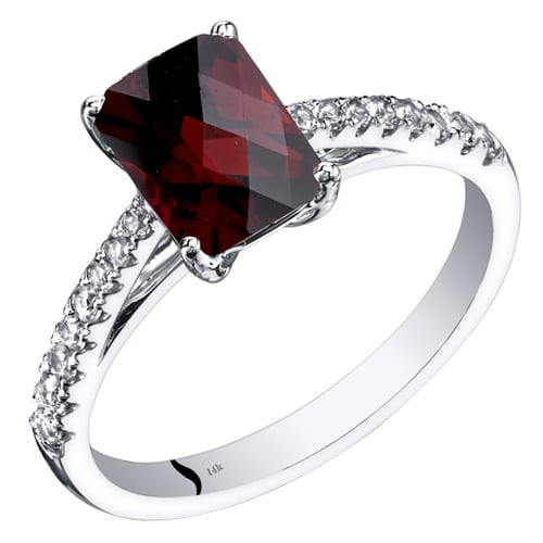 Zlatý prsteň s granátom a bielymi topásmi