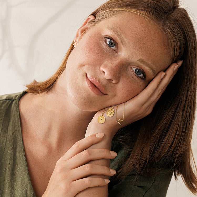 Zlatý prívesok so symbolmi znamenia zverokruhu 161312