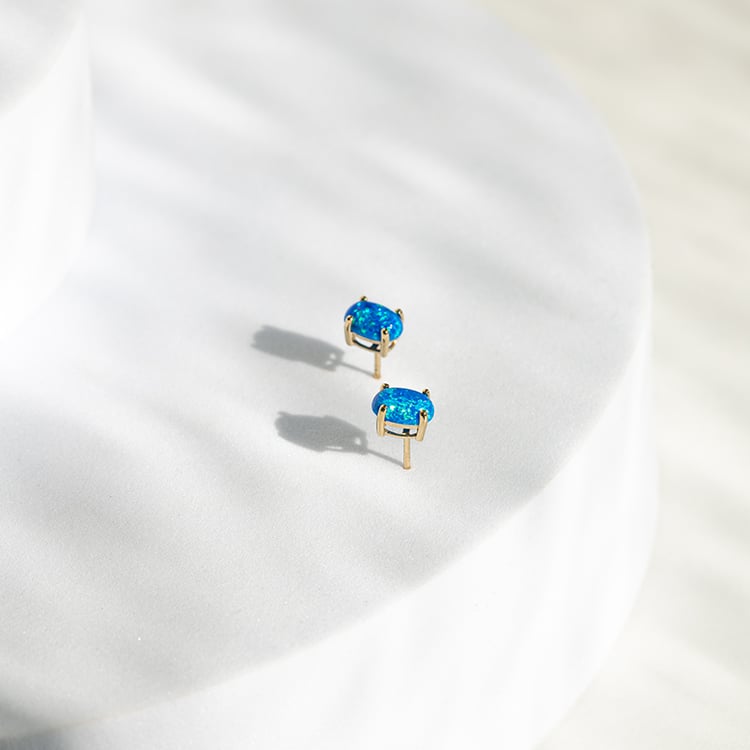 Modré oválne opály v zlatých náušniciach Jalia 145535