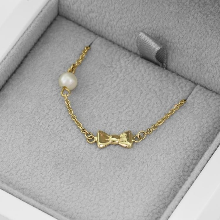 Detský náramok s mašličkou a perlou 51522