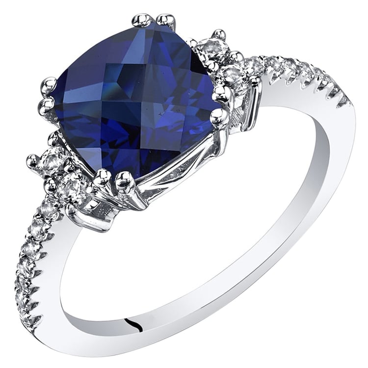 Zafír v zlatom prsteni s topásmi Pernel