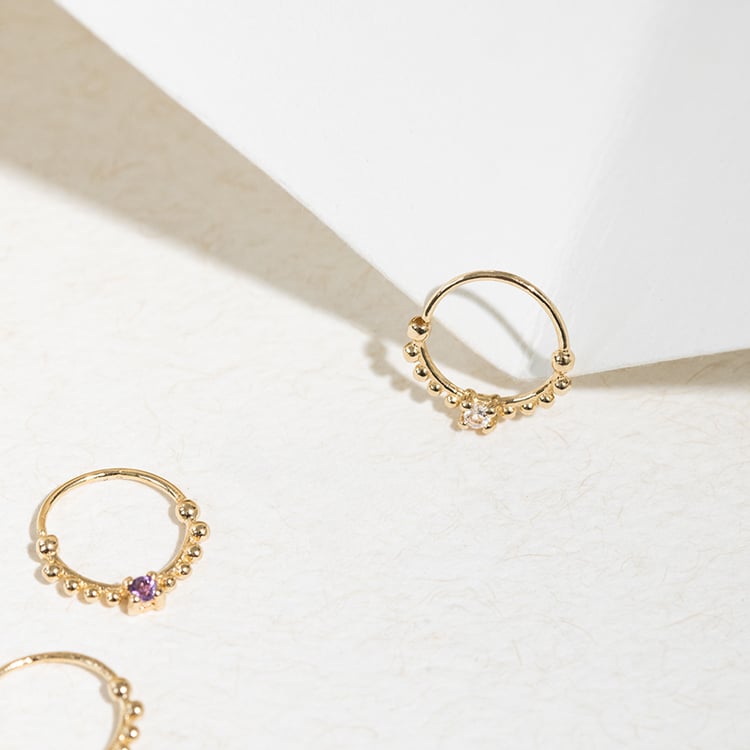 Zlatý septum piercing s bielym topásom Arla 123059