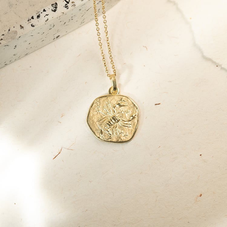 Zlatý prívesok so symbolmi znamenia zverokruhu 143664