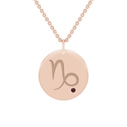 Zlatý prívesok so znamením a granátom Kozorožec