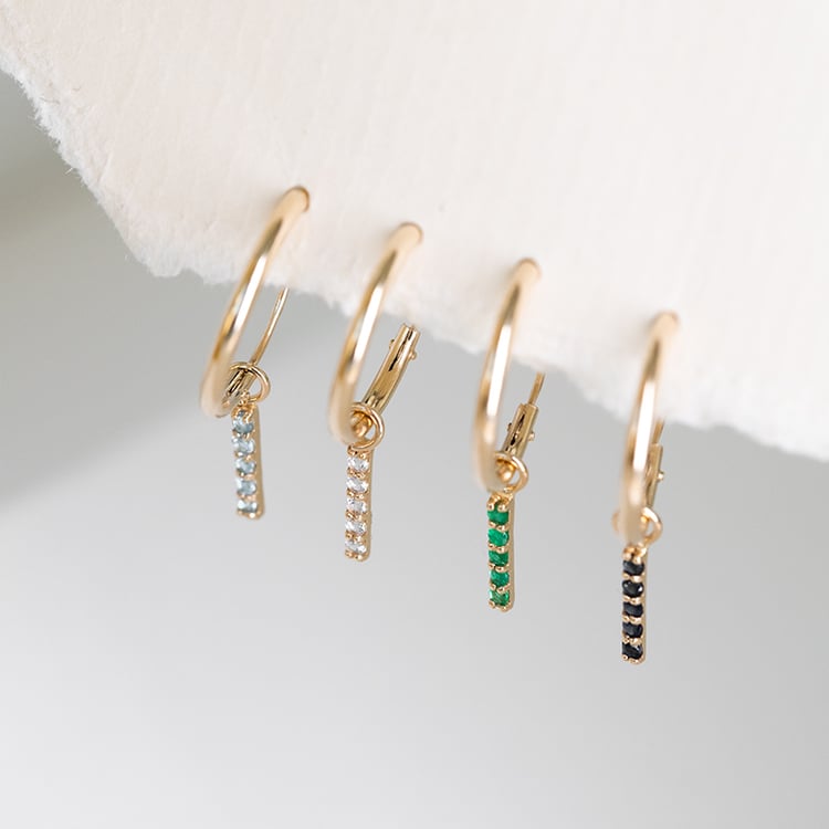 Zlaté visiace náušnice s bielymi topásmi Christy 122991