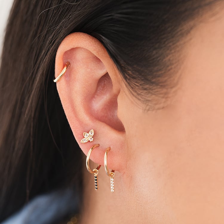 Zlatá piercing náušnica s bielymi topásmi Ciera 124487